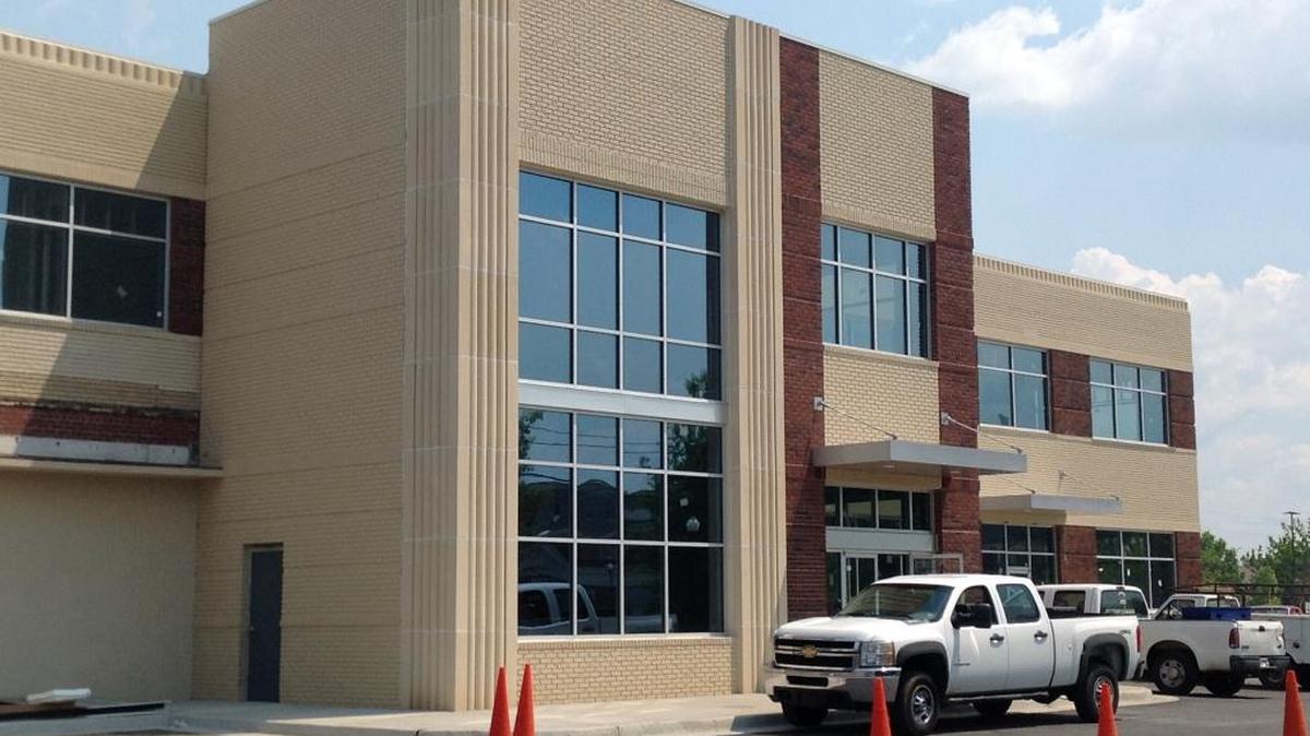 A 26,000-square-foot loft office building, shown Thursday at 408 12th St., at the intersection of Veterans Parkway in downtown Columbus, is moving toward completion. The structure, which has been rehabilitated at a cost of $3.1 million, is the former home of Strickland Motors years ago. --