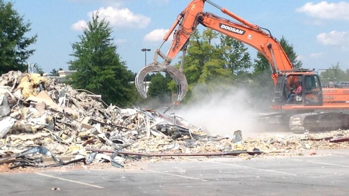 Crews put the finishing touches Tuesday on the demolition of the former Shogun Japanese restaurant at Columbus Park Crossing to make way for a new Chick-fil-A, which could be open by the holiday shopping season. W.H. Bass is the contractor of the project. --