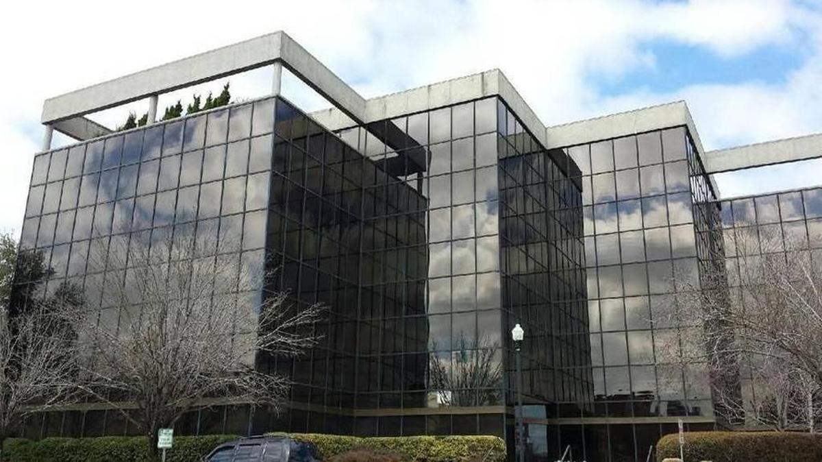 Greyrock’s prime acquisition is the glass-facade Carmike headquarters building at the corner of 13th Street and First Avenue.