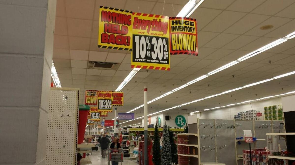 Signs let shoppers at the Phenix City store know Friday that discounts of between 10 percent and 30 percent are being offered as it and the Kmart on Macon Road and Sears department store in Columbus are liquidated for closure by spring. --