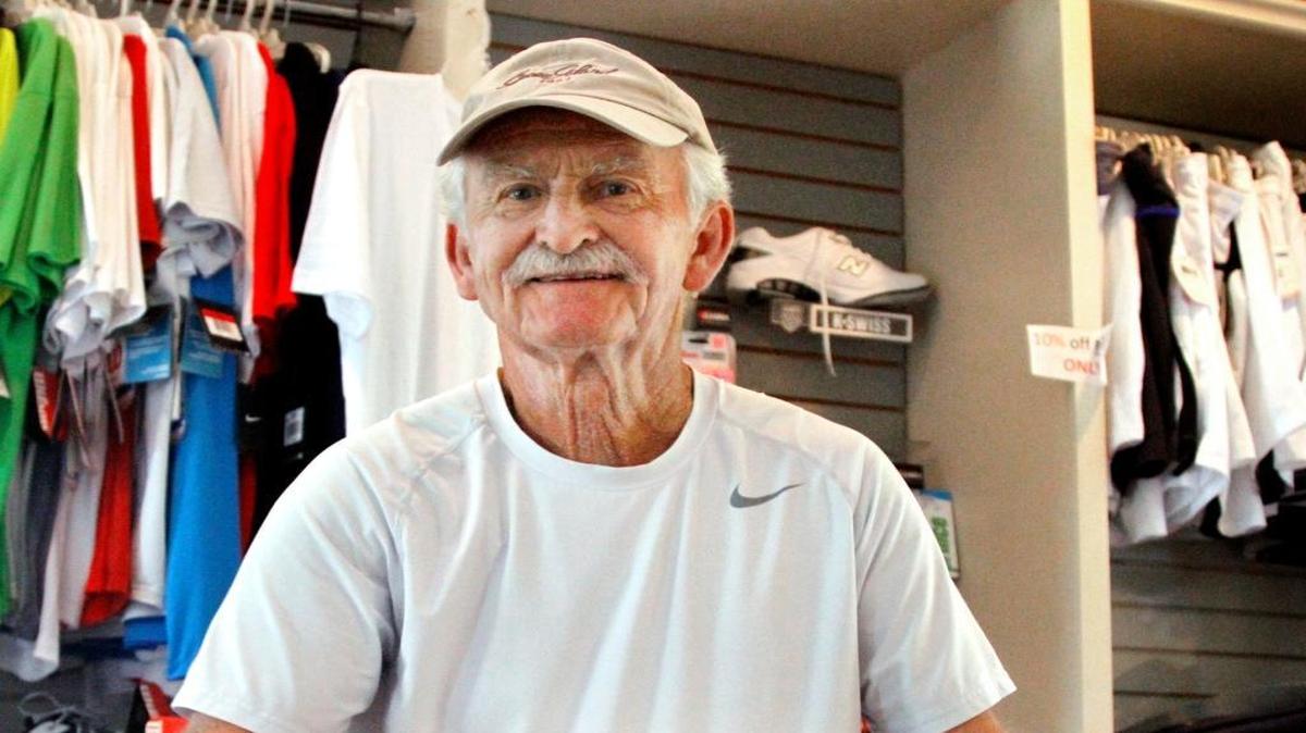 Green Island Tennis Center tennis pro Henry Banaszak strings a racket in the clubhouse. Banaszak is retiring after 45 years as the country club's tennis pro and will have the center named after him.