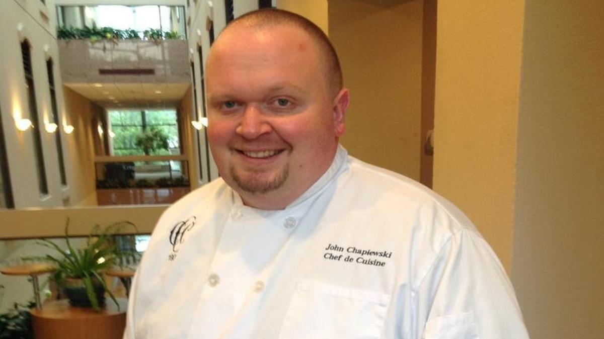 John Chapiewski, 42, a culinary instructor at Central High School in Phenix City, volunteers to teach cooking classes for Open Door Community House and even picks up extra money working at the Country Club of Columbus.