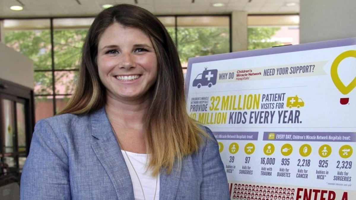Ashley Foster, president of business operations for the Columbus Cottonmouths, is also a volunteer with the local Children's Miracle Network effort.