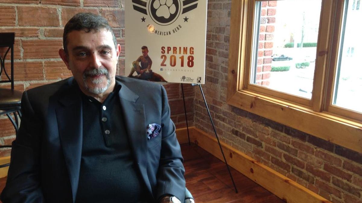 Richard Lanni, holding a book about World War I dog hero Sgt. Stubby, is executive producer of the upcoming animated film, “Sgt. Stubby: An American Hero,” and founder of Fun Academy Motion Pictures on 12th Street in Columbus. --
