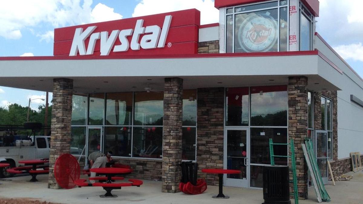 The Krystal restaurant at 1006 U.S. Hwy. 280 in Phenix City, shown here Friday, has been rebuilt from the ground up with a new prototype that includes a flashier design, complete with a corner clock, and new frozen treat menu items. It is now preparing to open. --