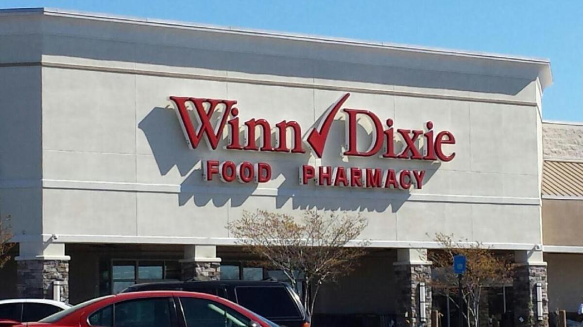 A Winn-Dixie supermarket in Columbus is being closed after its parent company Southeastern Grocers said Thursday it is eliminating 94 stores altogether under its three grocery brands -- Winn-Dixie, Harveys and BI-LO. /