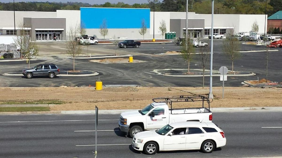 Traffic passes Wednesday in front of the Wal-Mart Supercenter under construction at 3515 Victory Drive in Columbus. The 159,357-square-foot store is headed for completion this summer, with employees expected to be on site by May to prepare for its opening.