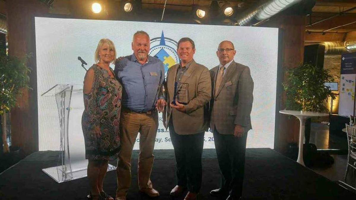 Pictured are (l-r) Susan Yaksh and Tim Logan of TLC Property Management, Jack Hayes of KW Commercial and David Domres, vice president of property management for Wisconsin-based Physicians Realty Trust.