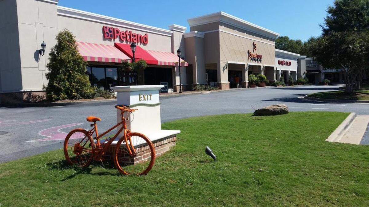 This orange bike is near the new Orangetheory Fitness in The Landings.