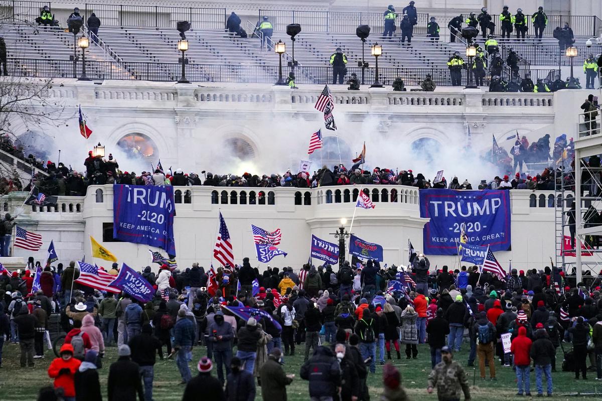 Violent insurrectionists storm the Capitol in Washington on Jan. 6, 2021. A local couple has been charged with four misdemanors in connection with the riot.