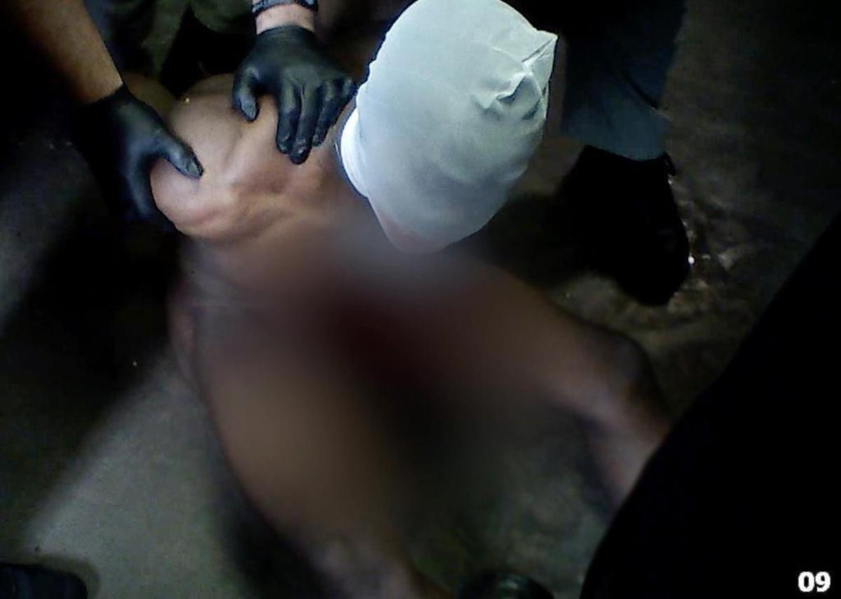 Muscogee County Sheriff’s deputies and correctional officers place a bite bag over the head of Cortney Jackson, a former inmate now suing city officials for cruel and unusual punishment. The incident occurred June 29, 2016.