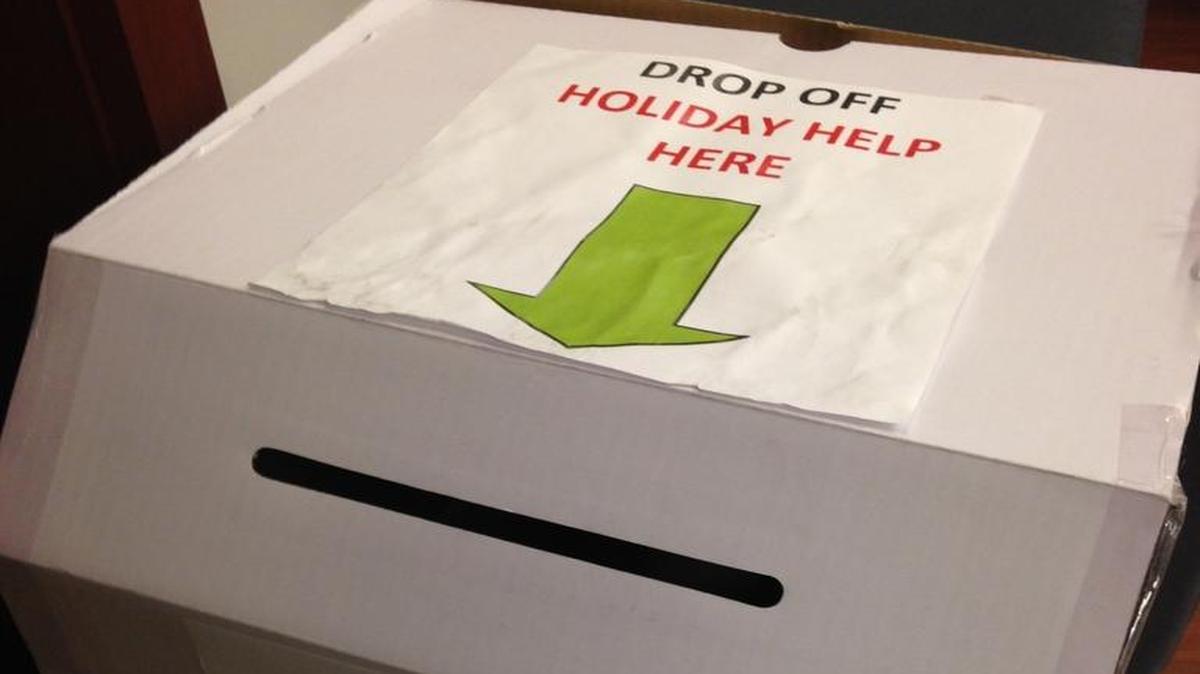 The holiday help box is outside the main Ledger-Enquirer office.