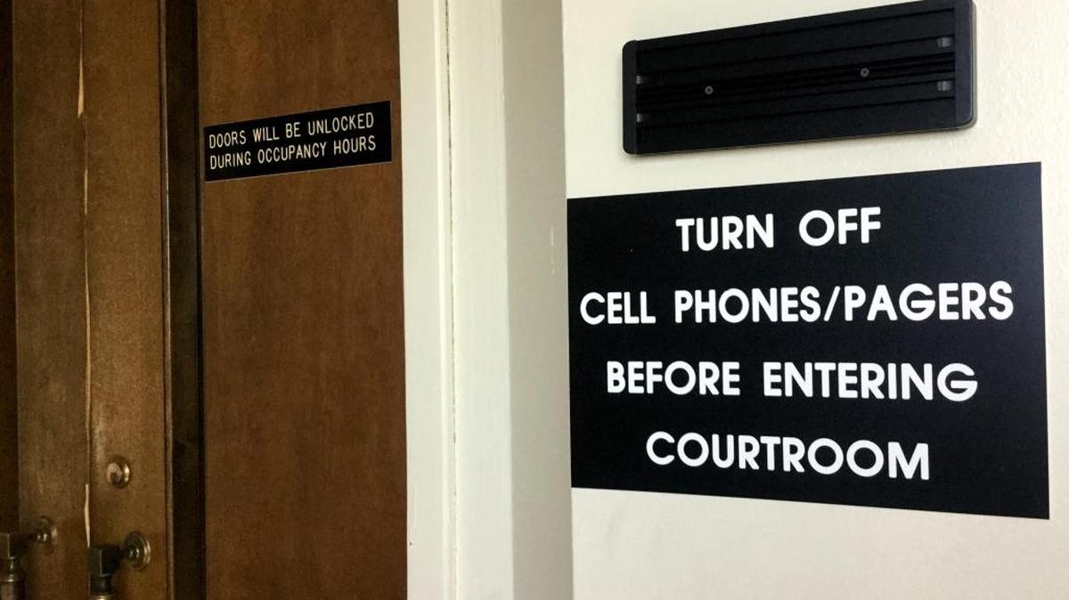 A sign outside Muscogee Superior Court warns visitors to turn their cell phones off before entering.