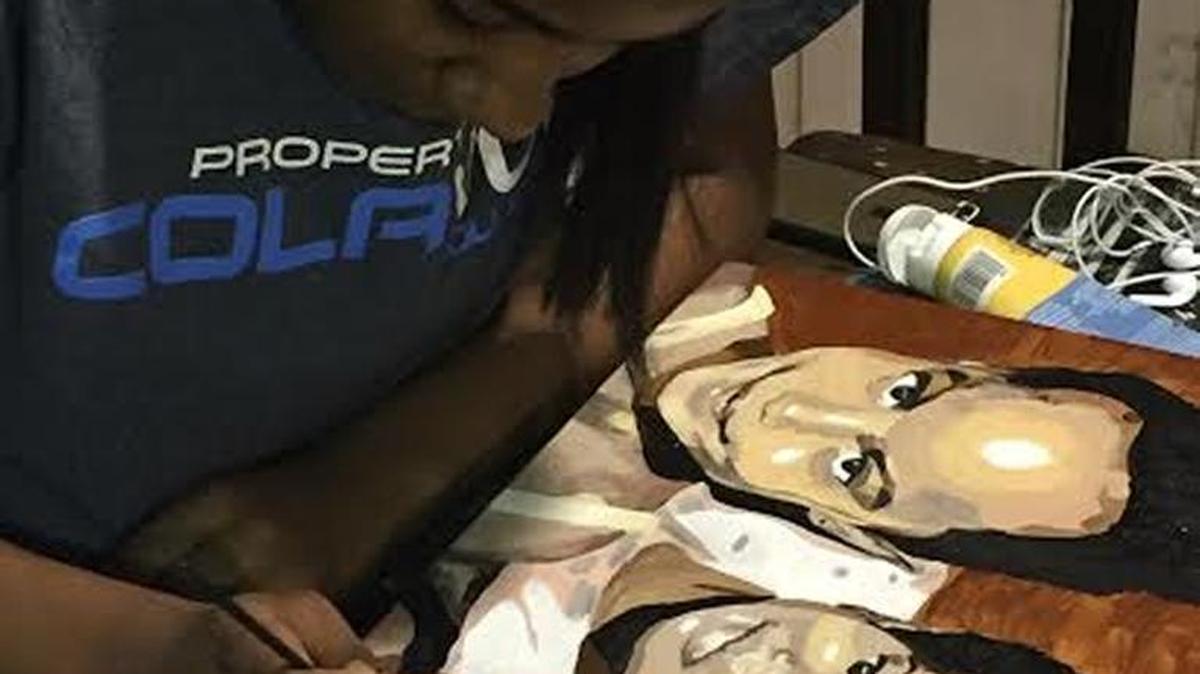 Barbara Joy "B.J" Tillman, a seventh-grader at St. Luke School, was commissioned to paint a portrait for First Lady Michelle Obama. She presented the free style rendering of Malia and Sasha Obama to their mother Thursday at the annual Fist Lady's Luncheon in Washington.