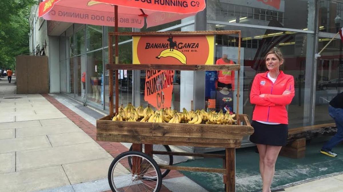 Big Dog Running Co. employee has a great job a couple of days a week giving away free bananas.