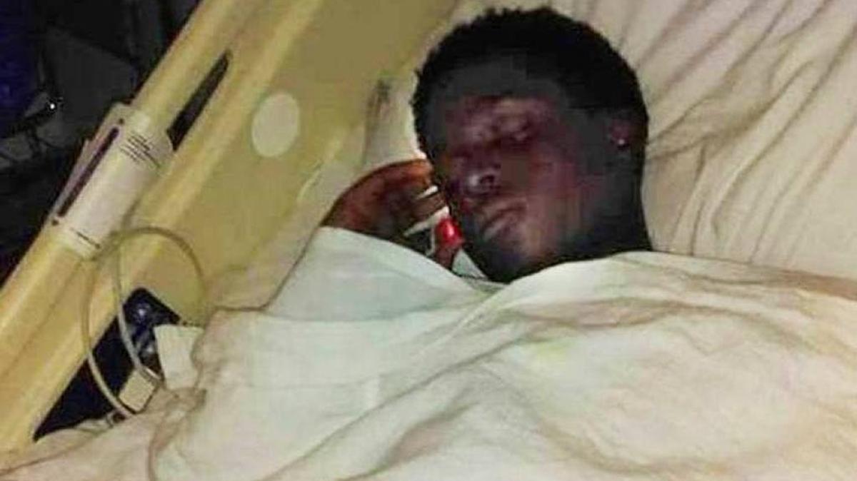 Montravious Thomas was photographed in his hospital bed.