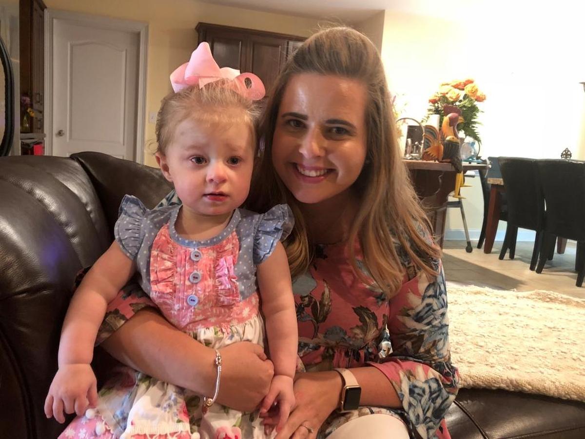 North Columbus Elementary School fourth-grade reading and social studies teacher Melanie Gouine, the Muscogee County School District 2018 Teacher of the Year, holds her 22-month-old daughter, Chloe, in their Phenix City home.
