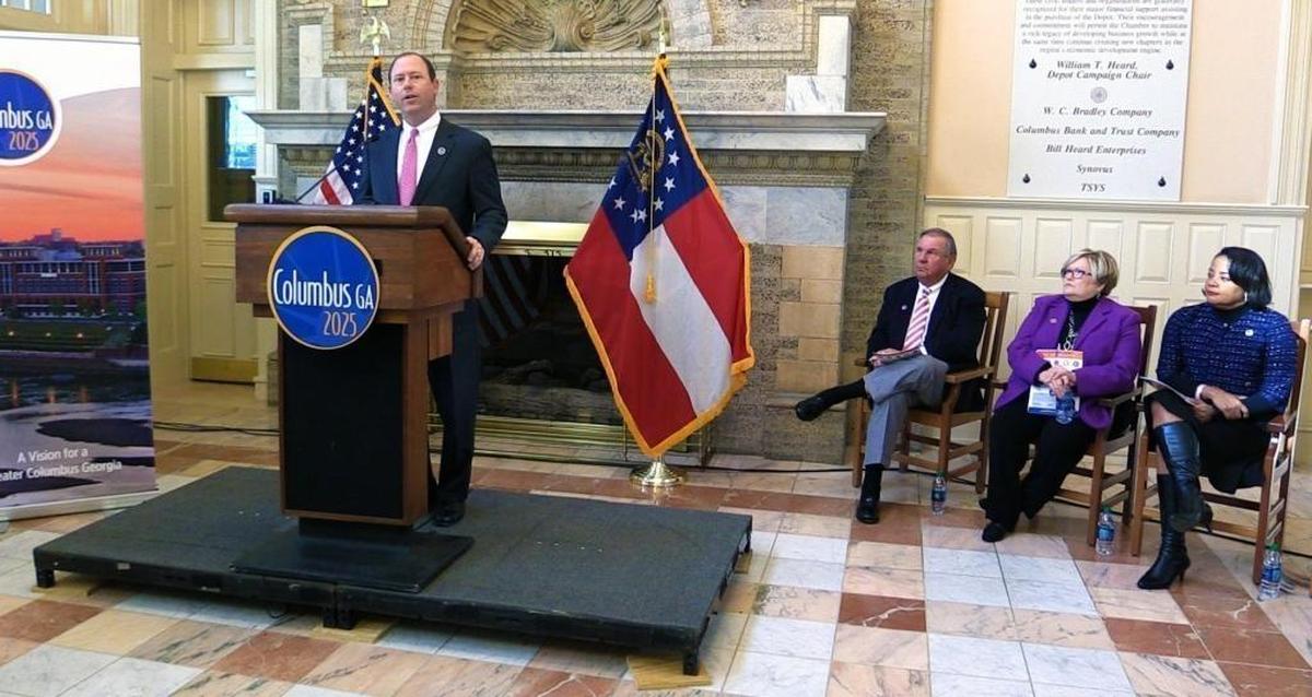 Billy Blanchard,left, chair of Columbus 2025, speaks Friday morning during the unveiling of Columbus 2025, a community and economic development strategy for the region. Seated to his left are Jimmy Yancey, Jacki Lowe and Audrey Tillman, all of whom spoke during the program at the Greater Columbus Georgia Chamber of Commerce.