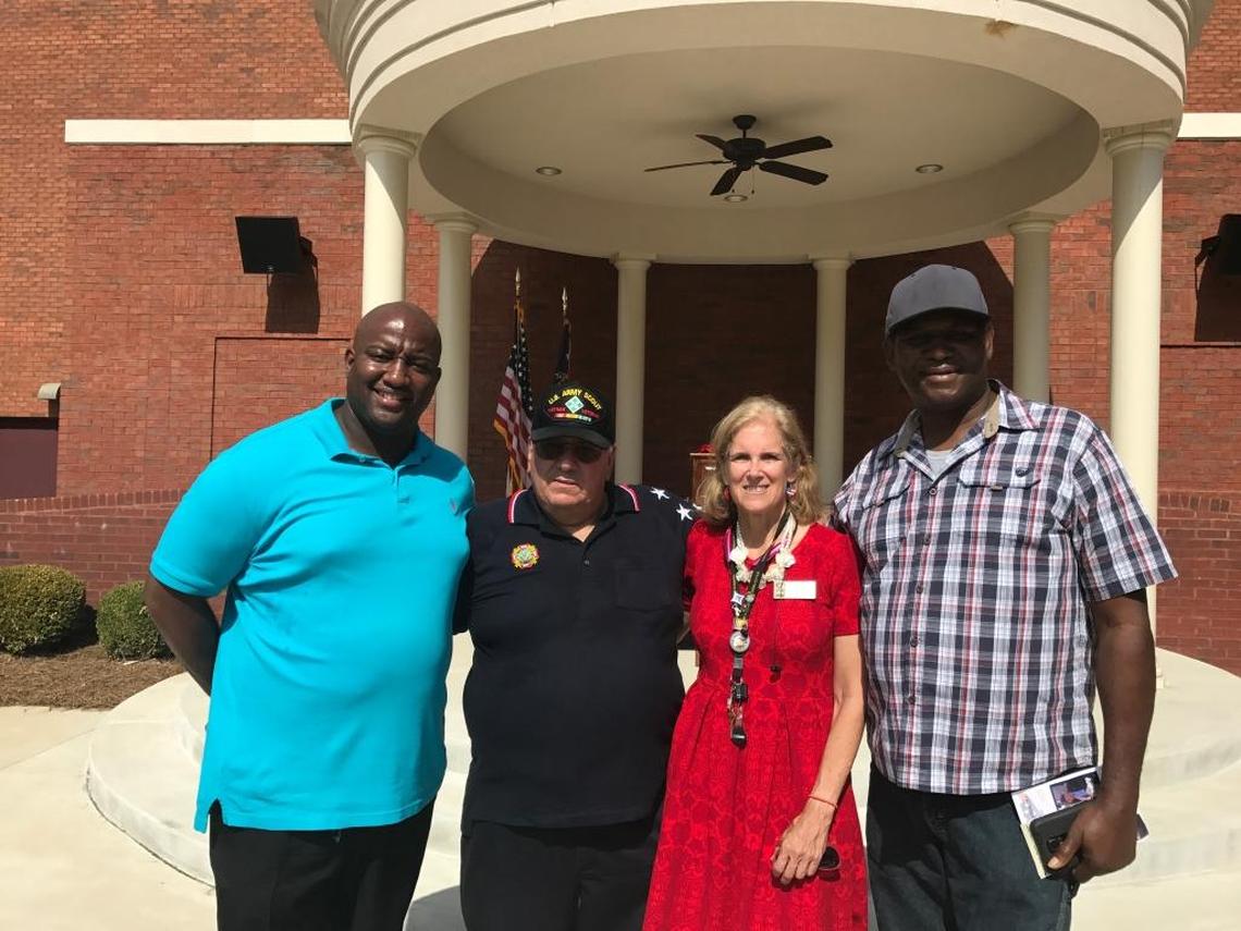 Scott Harrell and Larry Johnson, standing at the far left and far right respectively, traveled from Livingston, Texas, to attend a Memorial Day Heritage Walk Paver Dedication Ceremony at the National Infantry Museum, honoring their loved one Sgt. Johnny Vent Johnson and other soldiers who made the ultimate sacrifice.
