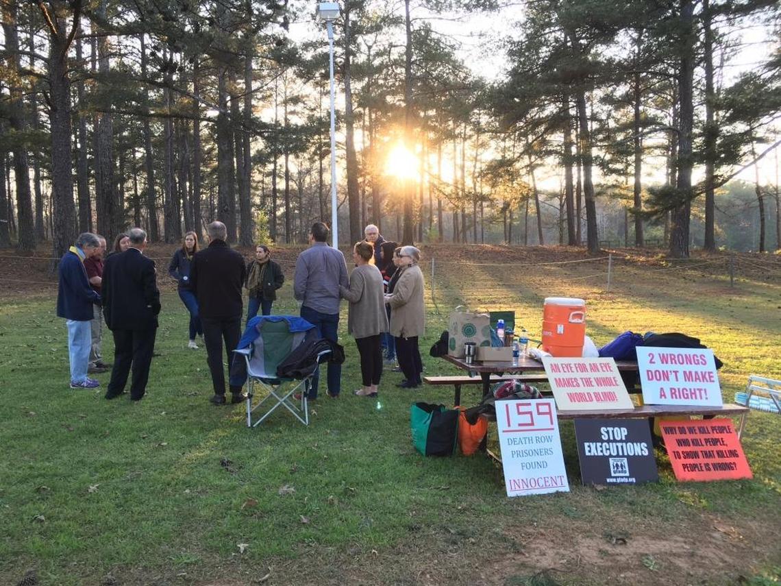 Protesters gather outside of the Georgia Diagnostic and Classification Prison in Jackson ahead of Carlton Gary’s execution.
