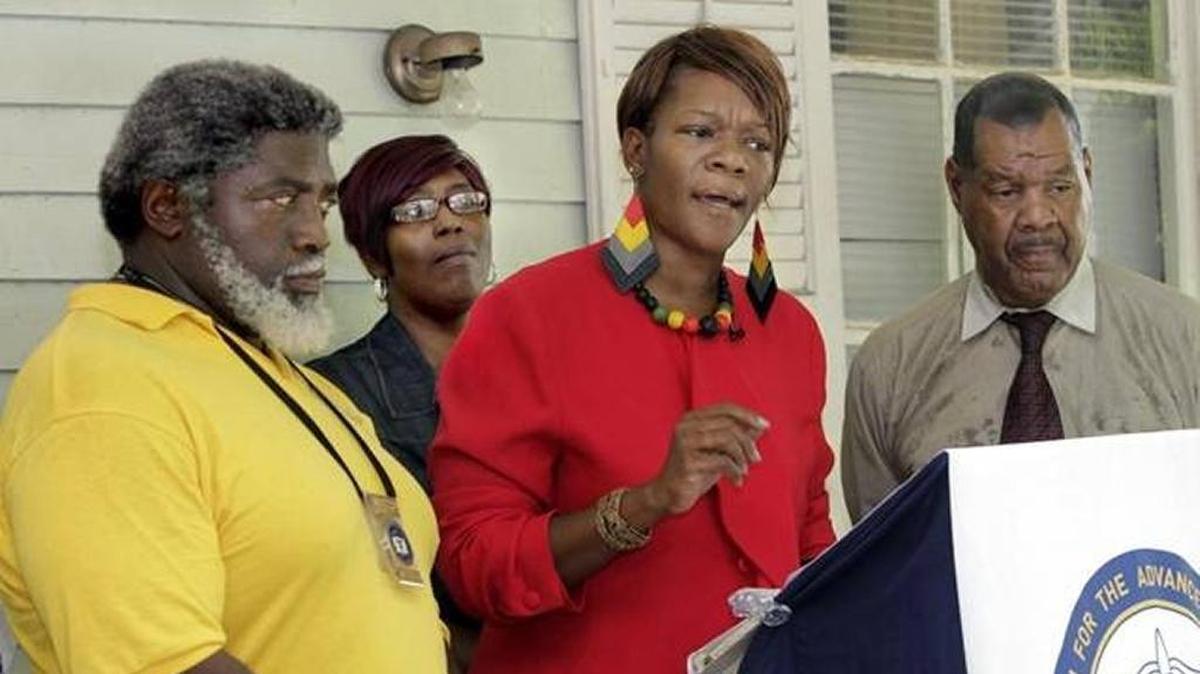 NAACP President Tonza Thomas leads press conference.