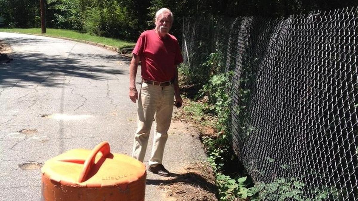 Mike Burnham walks daily near the damaged section of Bradley Circle near Bibb City.