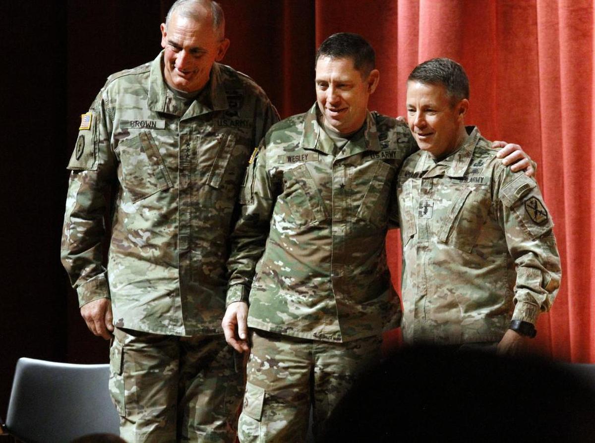 Lt. Gen. Robert Brown, left, Brig. Gen. Eric Wesley and Maj. Gen. Scott Miller stand for a photograph as the U.S. Army Maneuver Center of Excellence Change of Command ceremony comes to an end Friday at McGinnis-Wickham Hall. Brown is a former MCoE commanding general, Wesley is the incoming CG and Miller is the outgoing CG.