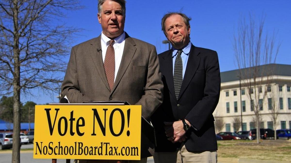 In this Feb. 15, 2015, file photo, Frank Myers, left, and John Thomas, members of the Muscogee County School Board, answer questions during a news conference as they unsuccessfully campaign against the renewal of the 1 percent Special Purpose Local Option Sales Tax that funds capital projects in the Muscogee County School District.