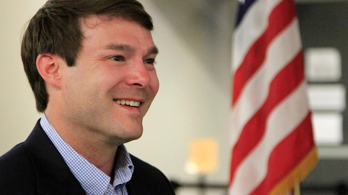 Walker Garrett smiles while answering a question from the media Tuesday night.