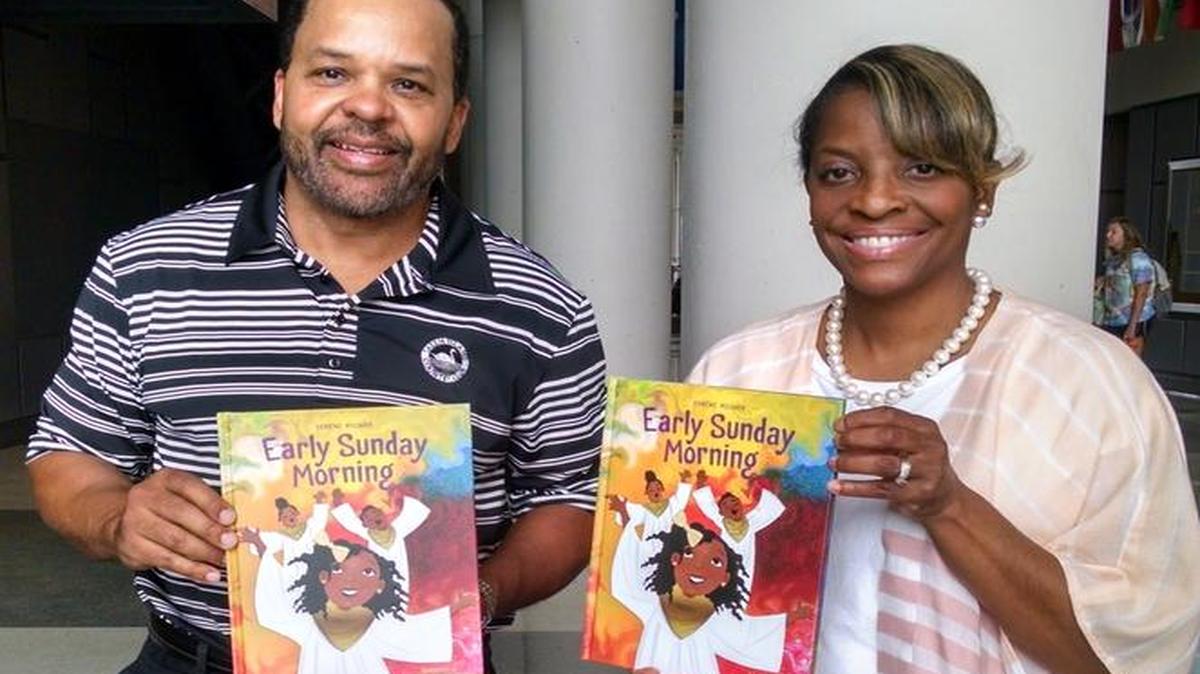 Warren Steele presenting copies of ‘Early Sunday Morning’ to Randalette Williams