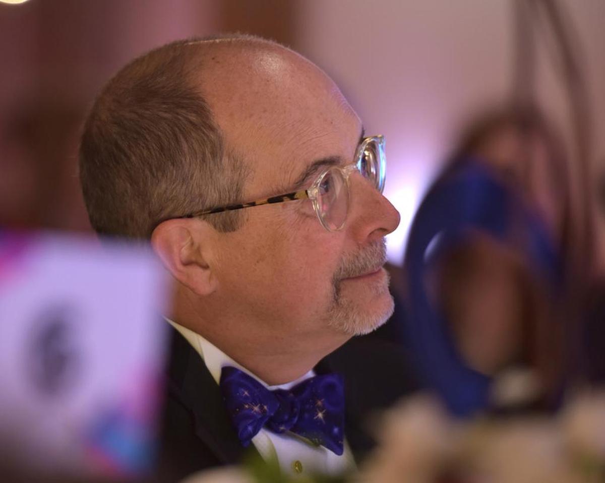 Rick McKnight watches as his granddaughter Martha Wade surprises him and his wife, Marquette, with a piano performance of “I’m Yours” by Jason Maraz during the American Cancer Society Columbus chapter’s Crystal Ball, March 10, 2018, at the RiverMill Event Centre.