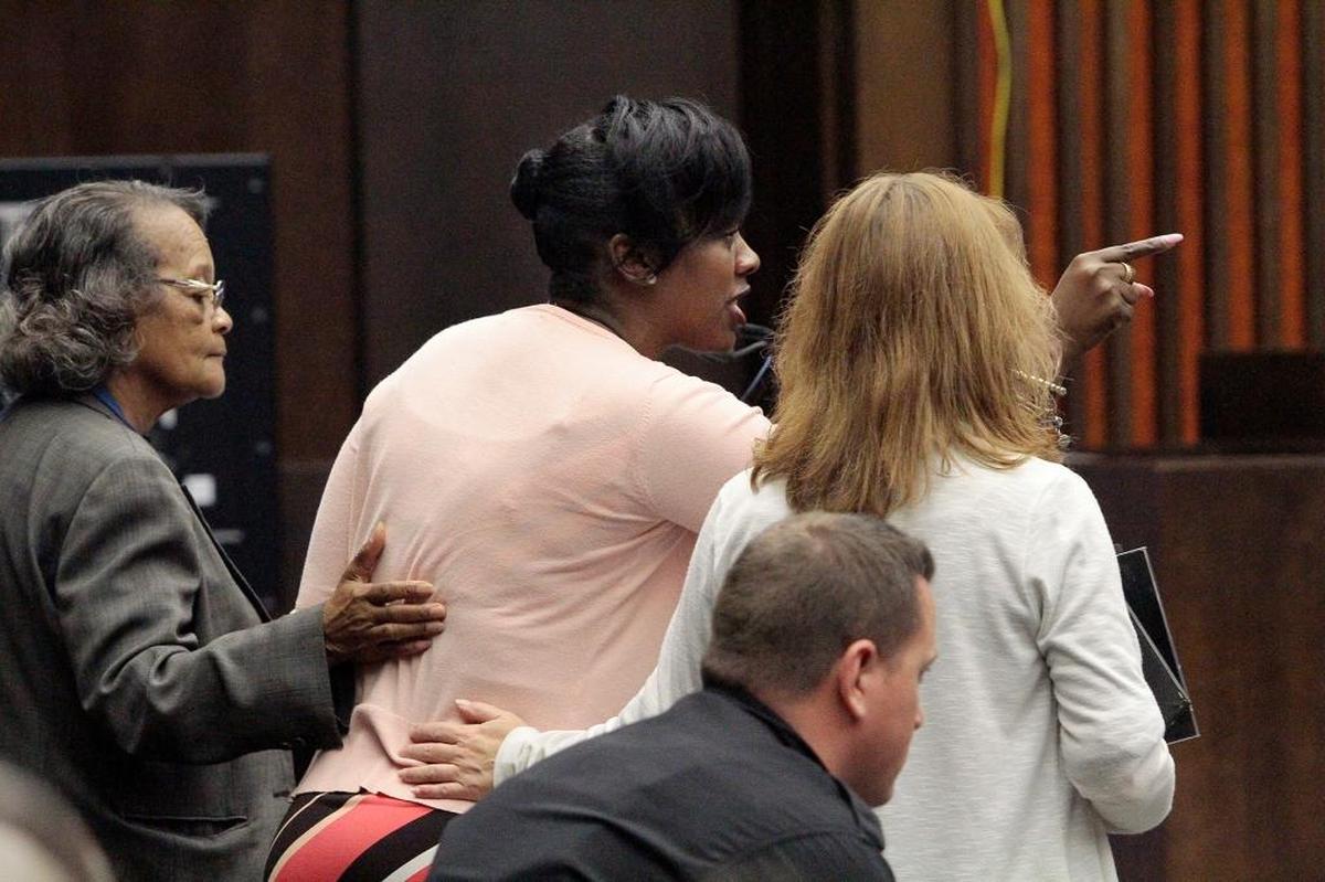 Shameika Averett, center, confronts convicted killer Jervarceary Tapley during Tapley’s sentencing hearing in Superior Court Friday. Tapley, a family friend, was sentenced to life without parole on three counts of malice murder in the brutal deaths of Gloria Short, 54, her son Caleb Short, 17, and her granddaughter Gianna Lindsey, 10.