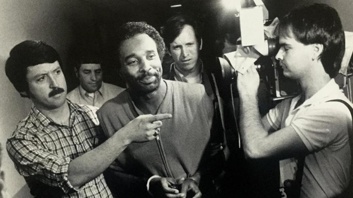 Detectives escort Carlton Gary into police headquarters after his arrest May 3, 1984.