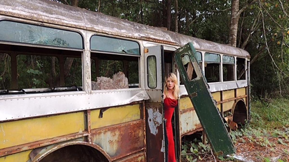 Not all uses of the old bus were ecclesiastical. Local photographer and bon vivant Dayton Preston took this photograph of a model posing on the old Victory Heights Baptist Church bus in the woods just off of Veterans Parkway.