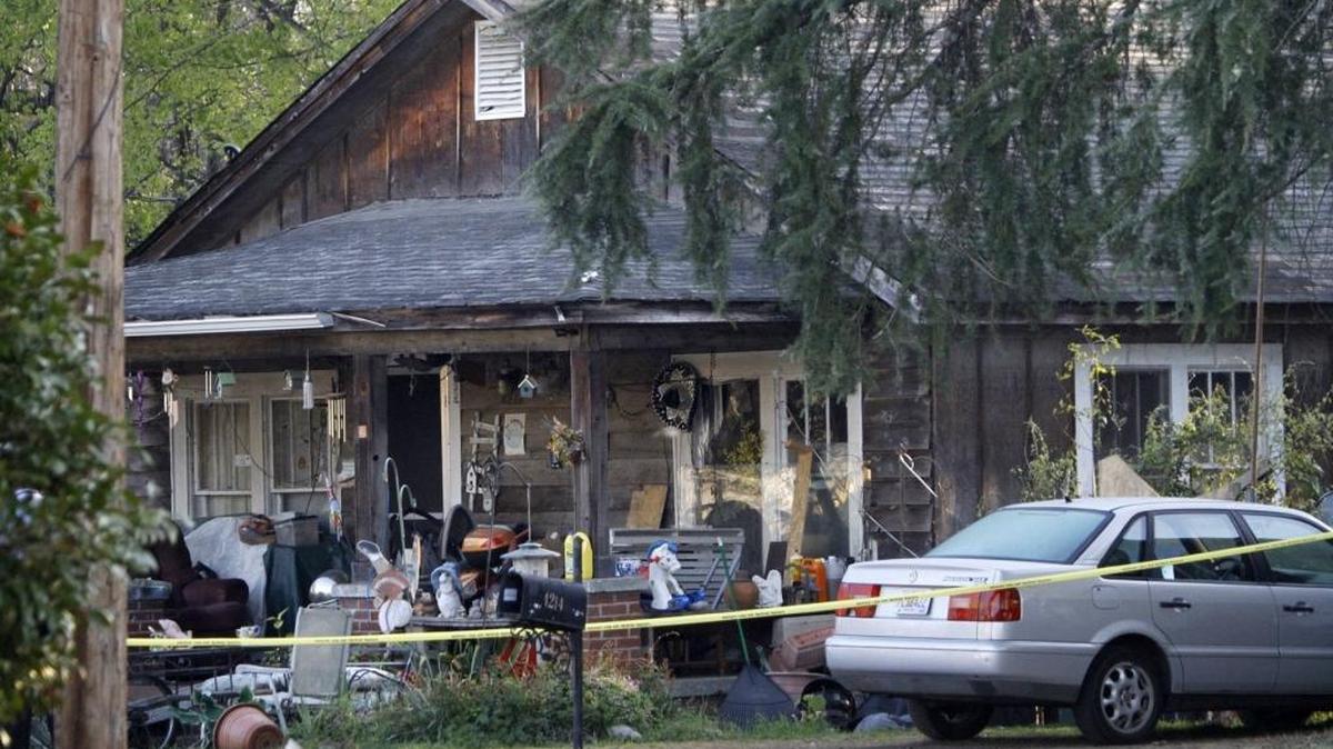 Columbus police officers, detectives and Georgia Bureau of Investigation officers respond to a police officer-involved shooting at 4218 Oates Avenue in March. The shooting occurred as the officer was serving a search warrant and arrest warrant, according to Columbus Police Chief Ricky Boren.