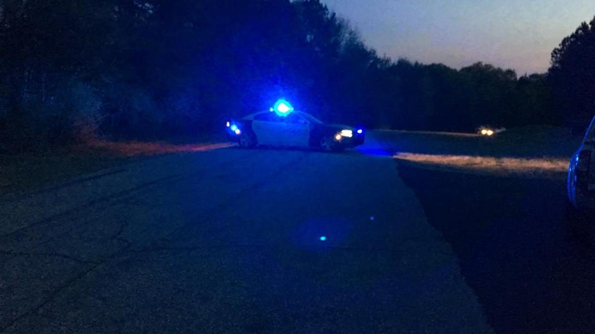 This access road at Lake Oliver Marina was blocked by police while a dive team searched Bibb Pond for a man, child on March 28, 2018 in Columbus.