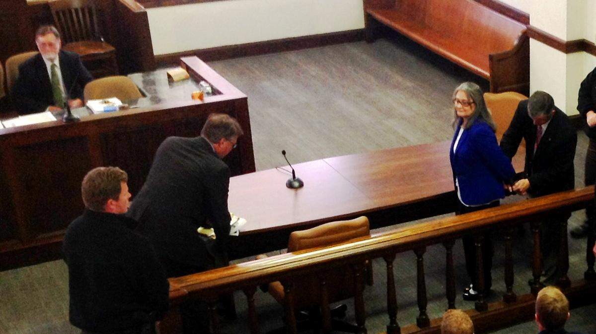 Taylor County Sheriff Jeff Watson handcuffs Diana Franklin after a jury found her guilty Monday of abusing her adopted daughter.