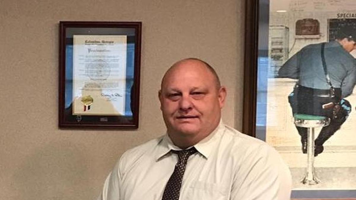 Sgt. Anthony Locey, at right, recently was presented an Officer of the Month honor from Police Maj. Gil Slouchick of the Bureau of Investigative Services at Columbus Police Department