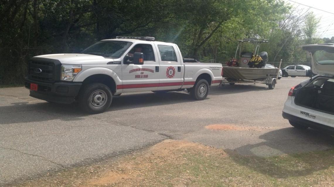 The Columbus Department of Fire and Emergency Medical Services removes equipment from the Lake Oliver Dam area on Thursday, March 29, 2018, after a day of searching for a missing man and his son.