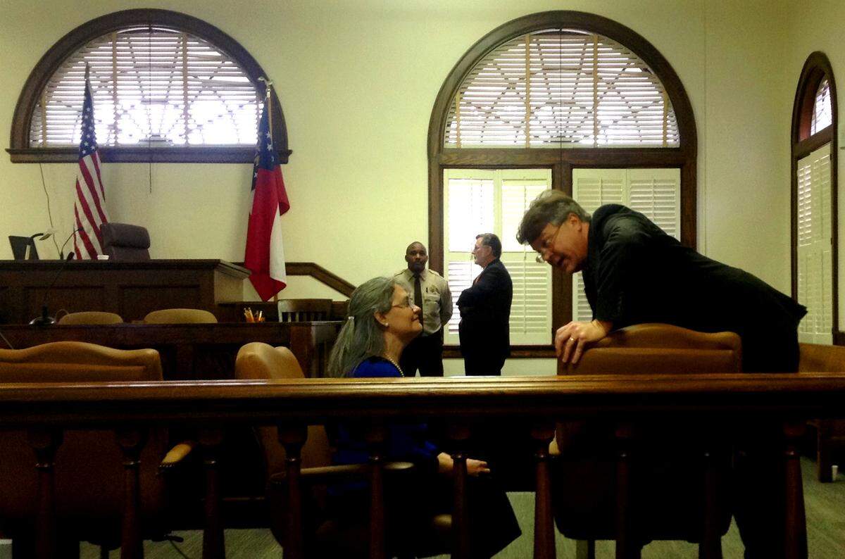 Diana Franklin talks to attorney Kevin Bradley during a court break.