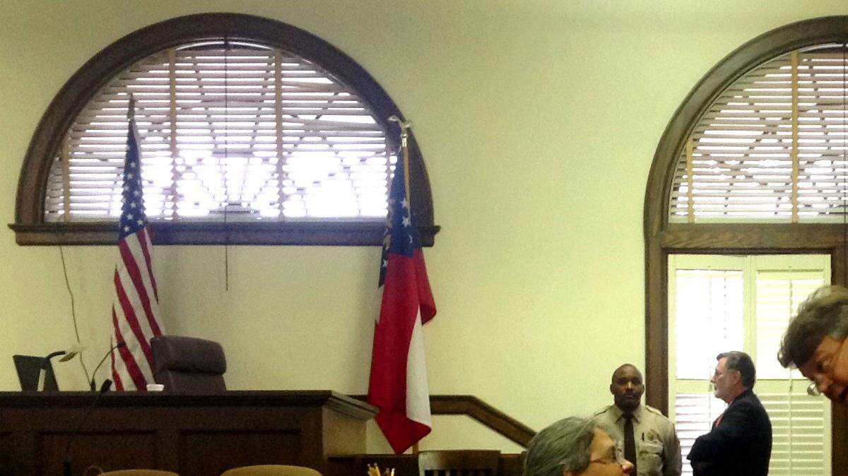 Diana Franklin talks to attorney Kevin Bradley during a court break.