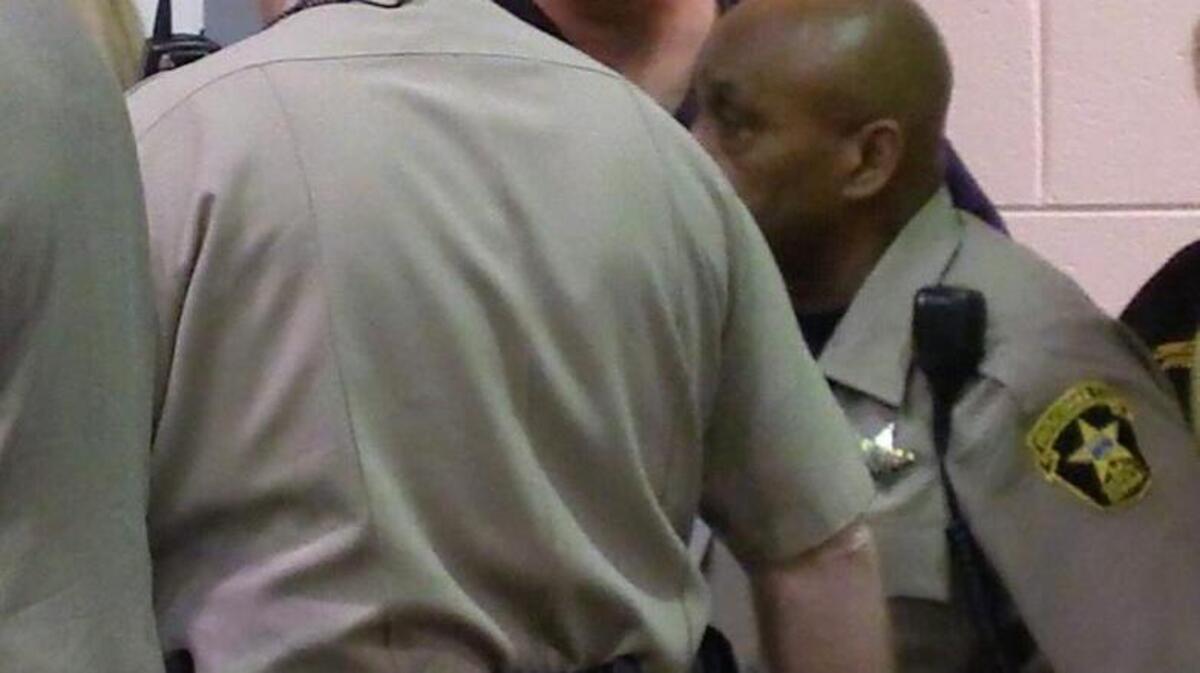 Timothy Tarr , facing camera, is escorted into Columbus Recorder's Court. Tarr pleaded not guilty to murder, aggravated assault and possession of a firearm during the commission of a crime. He was ordered held in the Muscogee County Jail with bond.