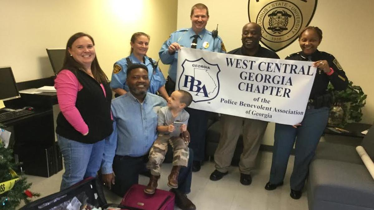 Members of the Police Benevolent Association present items to Lindsey Reis, director of Hope Harbour, at Columbus State University Police on Dec. 3, 2016. From right to left are Lt. Joyce Dent-Fitzpatrick, Freeman Johnson, CSU Lt. Brett Stanelle, officer Ashley Cook, Jackie Lee, past PBA president and Lee Reis.
