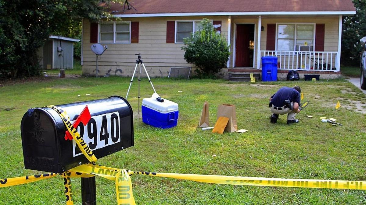 Columbus police investigate the scene of a fatal shooting at 2940 Gleason Ave. in Columbus on Aug. 8, 2014.