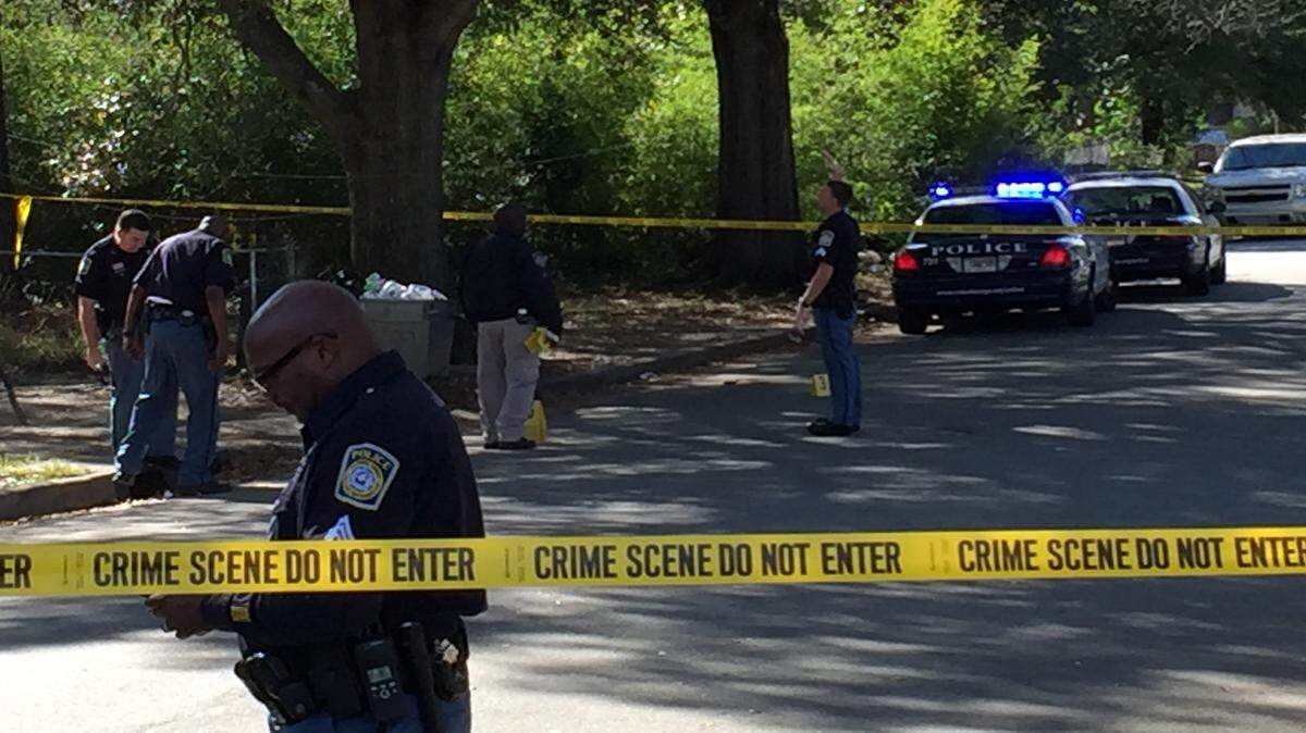Police have a portion of Cusseta Road blocked with crime tape.