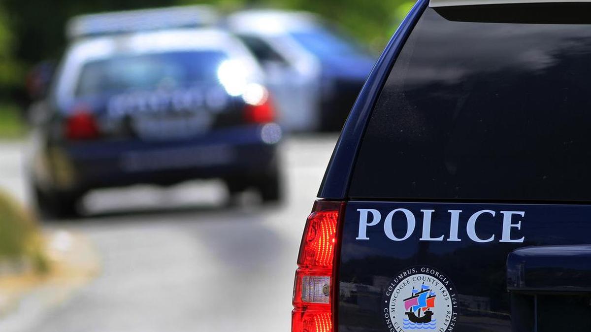 A Columbus police vehicle sits at a crime scene.