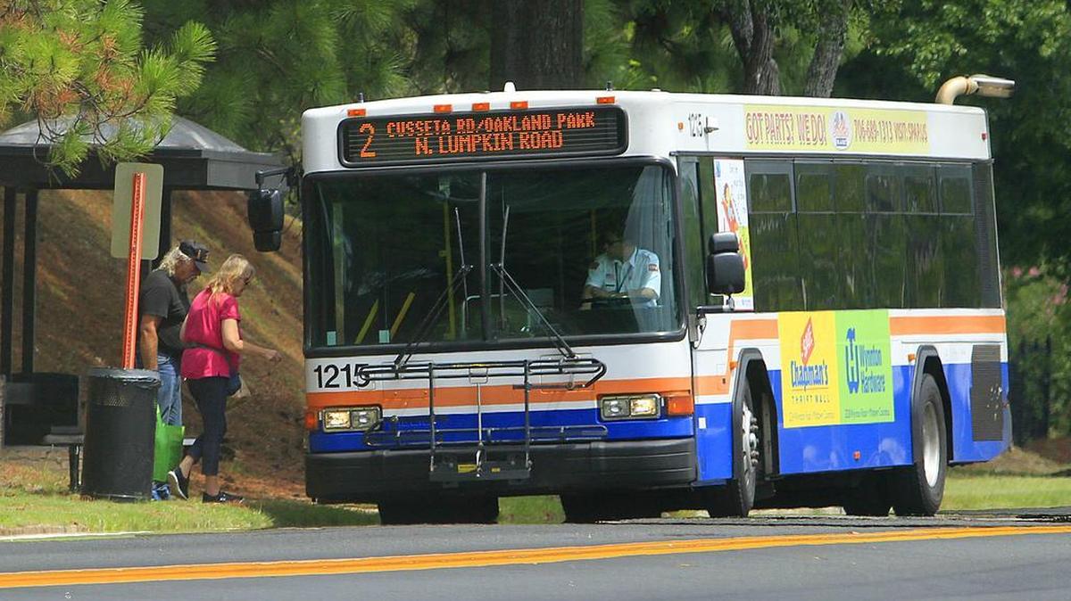 FILE -- Passengers board a METRA bus on Linwood Ave. in Columbus. The Columbus Consolidated Government is proposing changes which would mean the discontinuation of some routes.