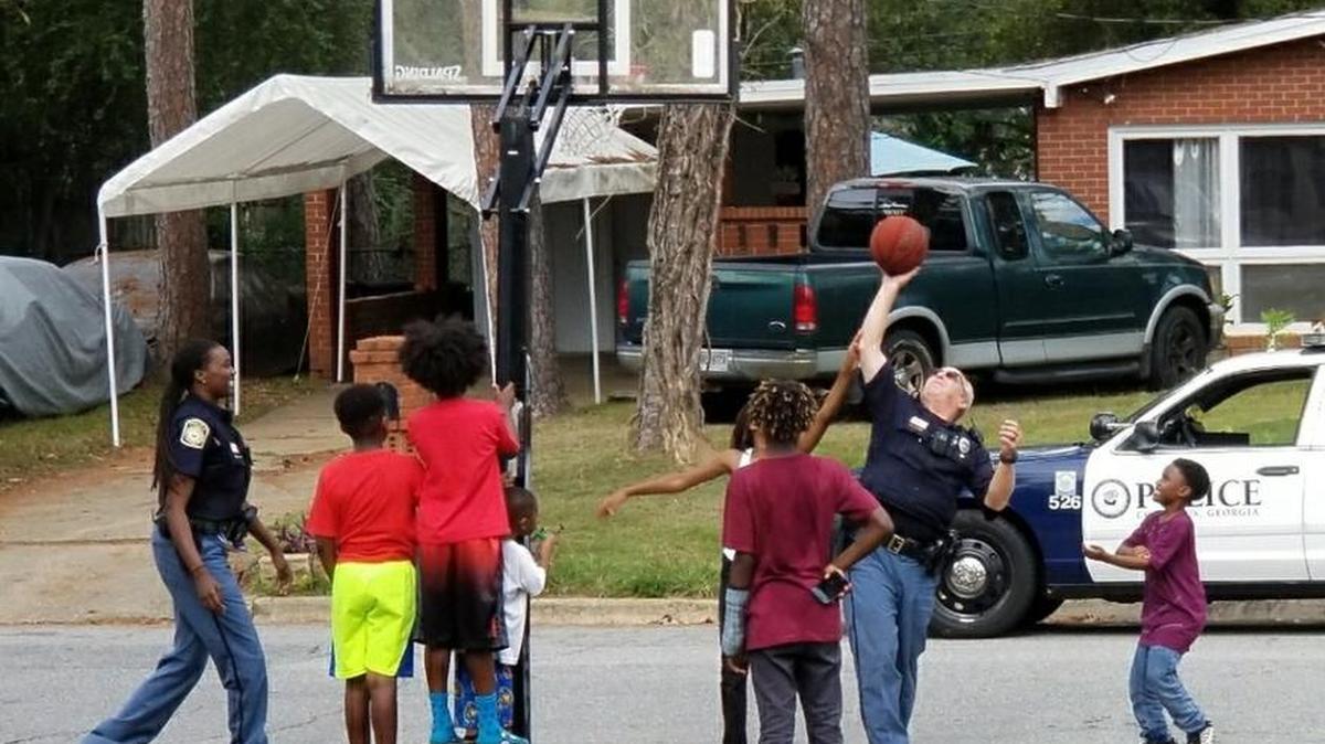 Officers Reeves and Henderson stopped to play some basketball with a group of kids in Oakland Park Sunday afternoon. Shanika Carter captured the moment happening in front of her house and said the experience made her 10-year-old son, Christian, think about officers in a more positive way.