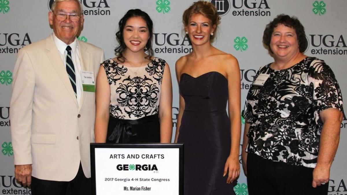 Columbus High School 2017 graduate Gabby Brickner, second from left, poses with her donors, from left, Ted Jenkins, Ashleigh Day and Janet Woodard, after winning the state title in the arts and crafts category during the Georgia 4-H Congress last month in Atlanta.