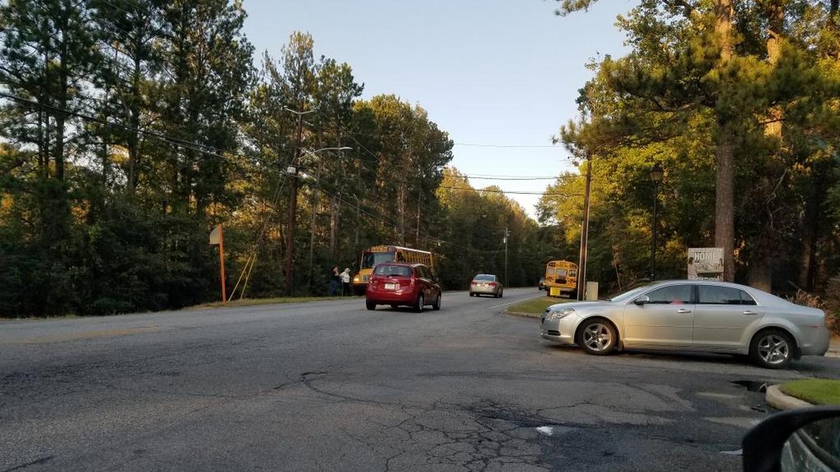 Fourteen students from Aaron Cohn Middle School were evacuated from Muscogee County School District bus 13-791 Friday when smoke started to come from the rear wheel well at a scheduled stop, the district announced Friday.